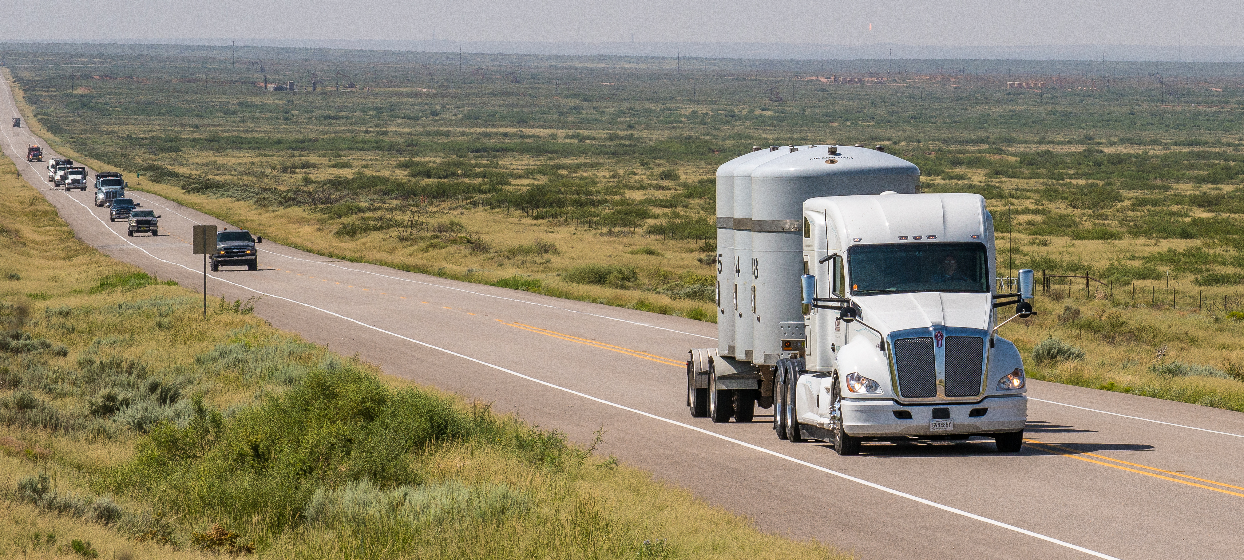 Waste Transport Delivery Truck safely travels down the road